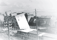Photograph of earthquake-damaged buildings in Niigata City, Kawagishi-cho, 1964.