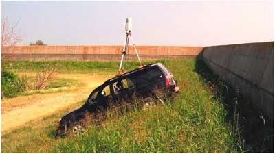 Photo of scanner on top of car at Entergy Plant I-Wall.