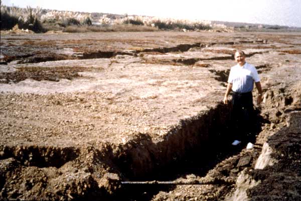 Photo of man standing in fissure at the Oakland International Airport.