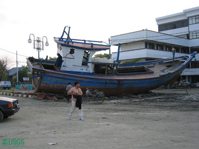 Photo taken in Banda Aceh of boat wrecked and stranded on land by the tsunami