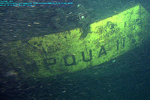Underwater photograph showing the name of the sunken barge Umpqua, taken by MBARI from their remotely-operated vehicle or ROV.