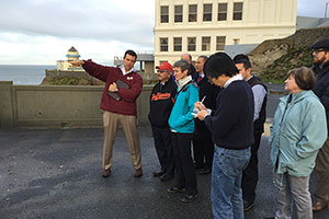Photo of Patrick, Mayor Ed Lee, Secretary Jewel, and others above Ocean Beach, San Francisco.