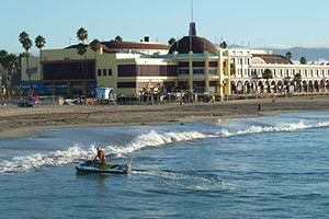 Tim Elfers using an echosounder and GPS receiver mounted on a personal watercraft to survey the seafloor just off the beach near the Santa Cruz Beach Boardwalk.