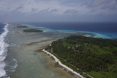 Aerial photograph of Kwajalein Atoll showing its low-lying islands and coral reefs.