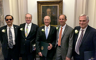 Photograph of five of twelve USGS employees who received the Department of the Interior Distinguished Service Award: (left to right) Rama Kotra, Peter Lyttle, James Hein, David Oppenheimer, and David Lockner.