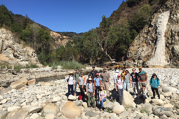 Field trip participants beside the Carmel River at the former site of the San Clemente Dam. USGS geologist Amy East is seventh from right. Credit: Tommy Williams, NOAA.