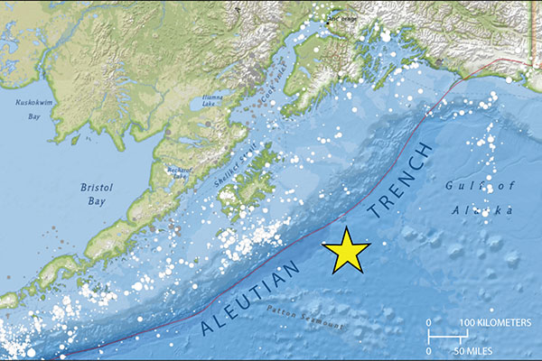 Map of Alaska and the surrounding ocean shows the terrain and ocean floor in relief, with a star south of the land in the ocean indicating the location of the epicenter of an earthquake that happened January 23, 2018.