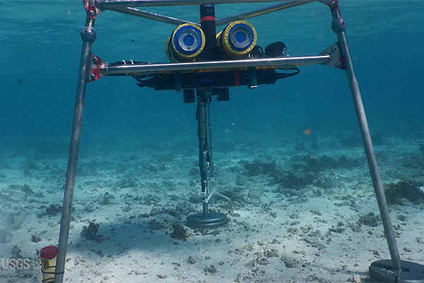 Photograph of a tripod, holding instrumentation, underwater in Australia.