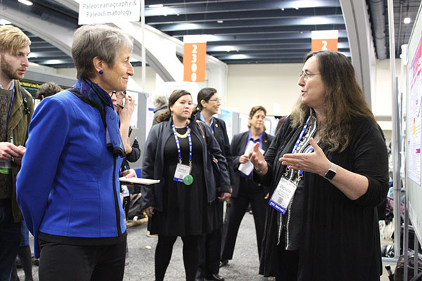 At the 2016 AGU Fall Meeting, USGS geophysicist Stephanie Ross speaks with Interior Secretary Sally Jewell about ways to help decision makers, emergency responders, and other stakeholders use scientific findings about tsunamis. Photo credit: USGS.