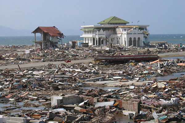 Photograph of a mosque left standing amid the rubble in Banda Aceh, following the tsunami on December 26, 2004. Photograph by Guy Gelfenbaum, USGS, taken January 21, 2005.