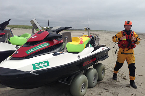 Tim preparing to launch a personal watercraft equipped with GPS and sonar for mapping the bottom close to shore.