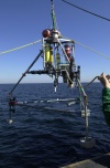 Image of tripod frame being deployed from USCG Cutter Marcus Hannah.