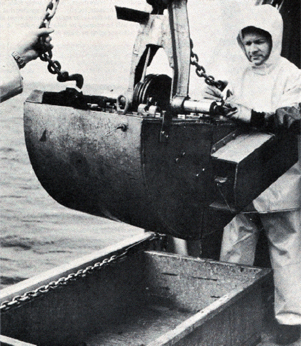 Photograph showing Campbell Grab Sampler being deployed at sea.