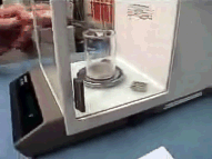 Image shows sample being weighed.