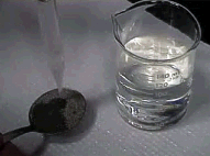 Sample placed in tablesppon being dampened with water.