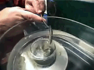 Sample being introduced into settling tube of rapid sediment analyzer.
