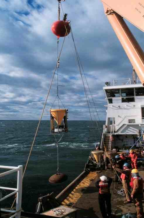 Figure 7A.  Subsurface mooring that includes a 36 inch steel float being deployed from U.S. Coast Guard Cutter Marcus Hannah in Massachusetts Bay.   