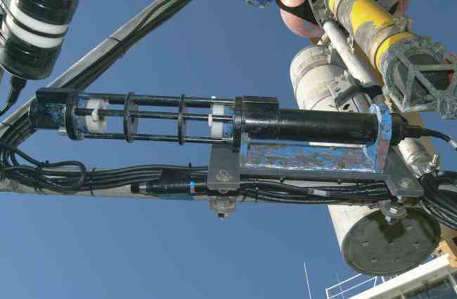 Figure 18. A Sea-Tech Transmissometer mounted horizontally on a tripod frame.  The white disks are coated with anti-foulant to prevent growth in the sensor path. 