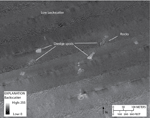 Figure 12. Detailed sidescan-sonar image showing dredge spoils in the southwestern part of the study area. An area of low backscatter can be seen in the northern part of the image. Boulders, characterized by high-backscatter targets with low-backscatter shadows, comprise some of the dredge spoils. Location of image shown in figure 2. 